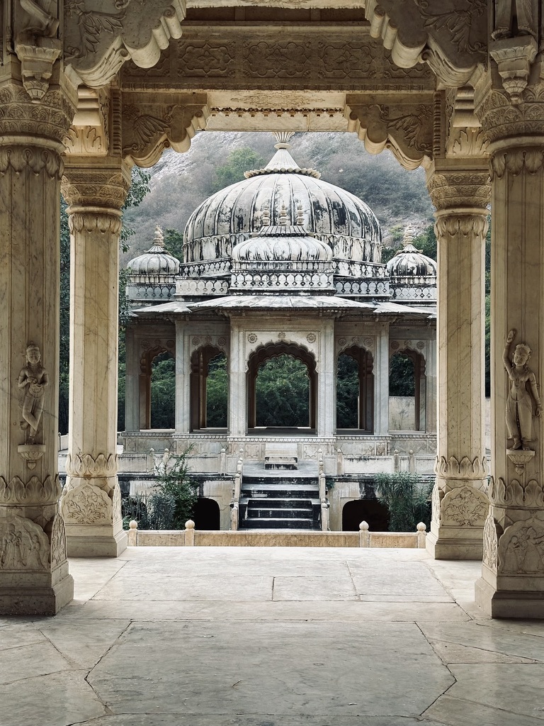 Domed garden pavilion framed by carved stone columns