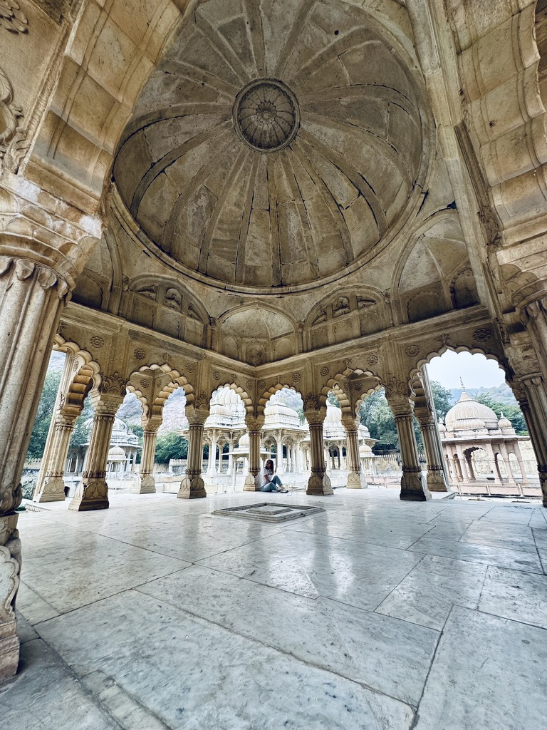Wide domed pavilion with scalloped arches and marble floors