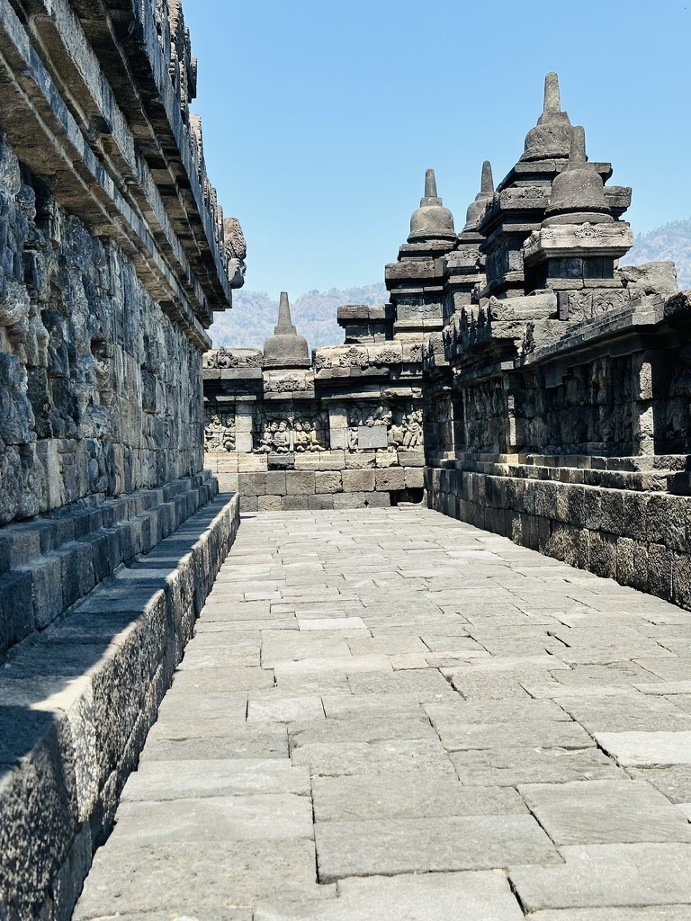 Stone passage and stone stupas at an ancient temple
