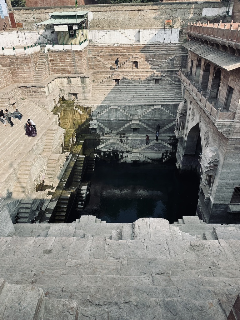 Geometric stone steps descending into an Indian stepwell
