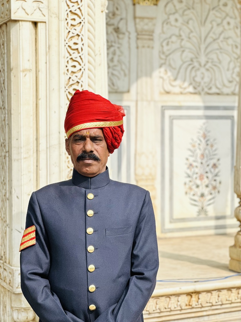 Palace guard wearing a vivid red turban