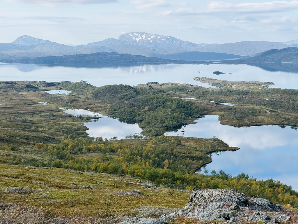Wide view across lakes and autumn hills in Swedish Lapland